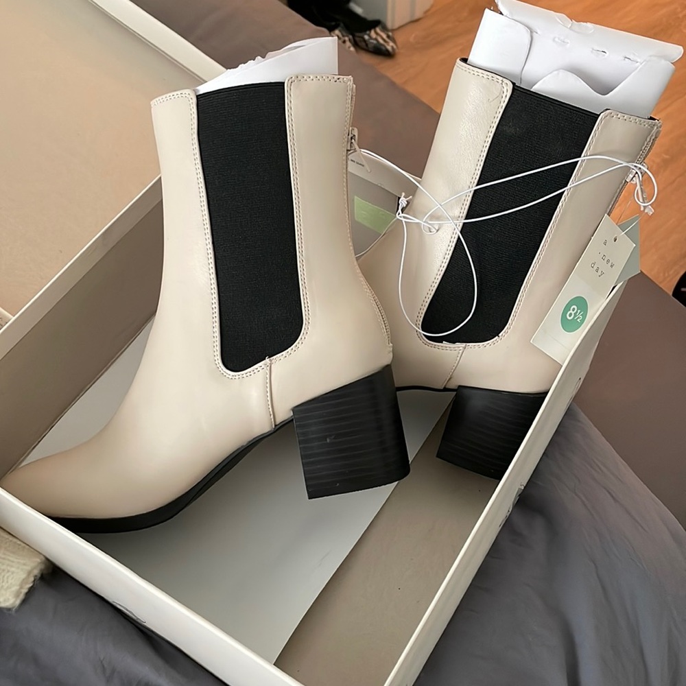 Brand new cream boots with black trim!